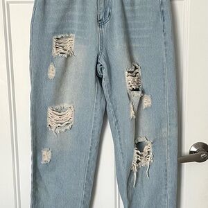 Kittenish destroyed blue jeans.